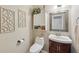 Well-appointed powder room with a modern vanity and toilet at 4035 Powerscourt Pl, Suwanee, GA 30024