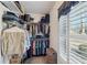 Spacious walk-in closet with ample shelving and hanging space at 4035 Powerscourt Pl, Suwanee, GA 30024