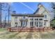 Home exterior featuring a spacious wooden deck and a backyard with mature trees at 976 Forest Pond Cir, Marietta, GA 30068