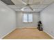 Finished basement space with carpet, drop ceiling, and natural light from a window at 976 Forest Pond Cir, Marietta, GA 30068