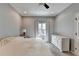 Bedroom with neutral walls, carpeted floor, window with curtains, and white dresser at 976 Forest Pond Cir, Marietta, GA 30068