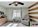 Bright bedroom with neutral walls, carpet, dresser, and window at 976 Forest Pond Cir, Marietta, GA 30068