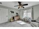 Bedroom with neutral walls, carpet, dresser, and natural light from a window at 976 Forest Pond Cir, Marietta, GA 30068