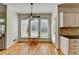 Charming breakfast nook bathed in natural light with hardwood floors and views of the backyard at 976 Forest Pond Cir, Marietta, GA 30068