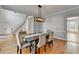 Elegant dining room with stylish furniture, hardwood floors, and a modern light fixture at 976 Forest Pond Cir, Marietta, GA 30068