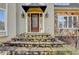 Inviting home front entrance featuring stone steps and a beautiful wooden door at 976 Forest Pond Cir, Marietta, GA 30068