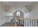 Hallway featuring staircase with decorative chandelier, railing, and carpet at 976 Forest Pond Cir, Marietta, GA 30068