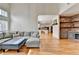 Inviting living room with a clear view to kitchen, featuring a stone bar and hardwood floors at 976 Forest Pond Cir, Marietta, GA 30068