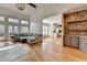 Stunning living room with stone bar, hardwood floors, and plenty of natural light at 976 Forest Pond Cir, Marietta, GA 30068