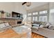 Cozy living room featuring a stone fireplace, vaulted ceiling, and hardwood floors at 976 Forest Pond Cir, Marietta, GA 30068