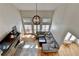 High-angle view of the spacious living room with fireplace, bar area, and a large sectional sofa at 976 Forest Pond Cir, Marietta, GA 30068