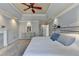 Comfortable main bedroom with decorative wall trim, light gray walls, and accent lighting at 976 Forest Pond Cir, Marietta, GA 30068