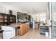 Bright dining room features modern light fixture, designer art pieces, and an adjacent view of the kitchen at 1371 Walking Way, Atlanta, GA 30316