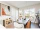 Well-lit dining room featuring stylish decor, contemporary lighting, and easy access to the outdoor balcony at 1371 Walking Way, Atlanta, GA 30316