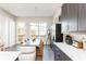 View of the dining room with a modern table, stylish chairs, and elegant lighting at 1371 Walking Way, Atlanta, GA 30316