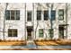 Attractive townhome facade with well-kept landscaping and inviting entryway at 1371 Walking Way, Atlanta, GA 30316