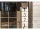 Close-up of the front door with the house number 1371, a modern lock, and a window at 1371 Walking Way, Atlanta, GA 30316