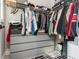 Organized walk-in closet featuring ample storage and a stylish geometric patterned rug for added flair at 1371 Walking Way, Atlanta, GA 30316