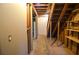 Unfinished basement with exposed ceiling and stairs leading to the main floor at 2265 Pine Point Dr, Lawrenceville, GA 30043