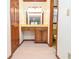 Hallway with vanity and mirror leading to a yellow tiled bathroom at 2265 Pine Point Dr, Lawrenceville, GA 30043