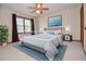 Virtual staged bedroom with a large bed, a nightstand and houseplant at 2265 Pine Point Dr, Lawrenceville, GA 30043