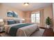 Staged bedroom with a queen bed and modern decor at 2265 Pine Point Dr, Lawrenceville, GA 30043