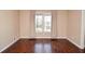 Bedroom featuring hardwood floors and a large window at 2265 Pine Point Dr, Lawrenceville, GA 30043