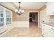 Bright breakfast nook with tile flooring, granite countertops, and a view to the Gathering room at 2265 Pine Point Dr, Lawrenceville, GA 30043