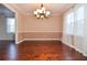 Elegant dining room with hardwood floors, decorative lighting, and large windows at 2265 Pine Point Dr, Lawrenceville, GA 30043