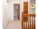 Hallway with wooden railing and doors leading to other rooms in the home at 2265 Pine Point Dr, Lawrenceville, GA 30043