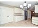 Kitchen space with white cabinets, tile floors, stainless appliances and nearby pantry at 2265 Pine Point Dr, Lawrenceville, GA 30043