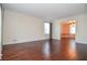 Spacious living room with hardwood floors, crown molding, and a view to dining room at 2265 Pine Point Dr, Lawrenceville, GA 30043