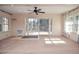 Bright living room with sliding doors leading to a deck at 2265 Pine Point Dr, Lawrenceville, GA 30043