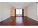 Bright and airy living room with gleaming hardwood floors and large windows at 2265 Pine Point Dr, Lawrenceville, GA 30043