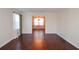 Open-concept living room featuring gleaming hardwood floors and abundant natural light at 2265 Pine Point Dr, Lawrenceville, GA 30043