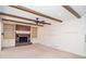 Inviting living room featuring a brick fireplace and wood beam ceiling at 2265 Pine Point Dr, Lawrenceville, GA 30043