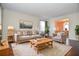 Staged living room with hardwood floors, a neutral color palette, and a cozy atmosphere at 2265 Pine Point Dr, Lawrenceville, GA 30043