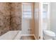 Clean, well-lit bathroom featuring a tiled shower-tub combo and a comfort height toilet at 2600 Burkshire Rd, Ellenwood, GA 30294