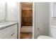 Inviting bathroom with granite countertops and a shower-tub combo with decorative tiled walls at 2600 Burkshire Rd, Ellenwood, GA 30294