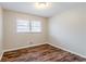 Bedroom featuring wood floors, a window, and light colored walls at 2600 Burkshire Rd, Ellenwood, GA 30294