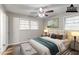 Bedroom with wood floors, neutral walls, and two sunny windows at 2600 Burkshire Rd, Ellenwood, GA 30294