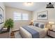 Bedroom with neutral walls and furnishings under soft lighting at 2600 Burkshire Rd, Ellenwood, GA 30294