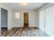 Dining area with wood floors and sliding glass doors to the backyard at 2600 Burkshire Rd, Ellenwood, GA 30294