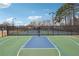 Community basketball and tennis courts offer diverse recreational options for residents at 4035 Crabapple Lake Ct, Roswell, GA 30076