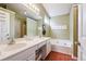 Well-lit bathroom boasts a double sink, a soaking tub, and a separate shower at 4035 Crabapple Lake Ct, Roswell, GA 30076