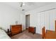 Bright bedroom with a closet, dresser, and a neutral color palette at 4035 Crabapple Lake Ct, Roswell, GA 30076