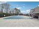 Covered community pool area, featuring lounge chairs and a well-maintained concrete patio at 4035 Crabapple Lake Ct, Roswell, GA 30076