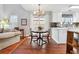 Charming dining area featuring hardwood floors, a round table, and natural light from the sliding doors at 4035 Crabapple Lake Ct, Roswell, GA 30076