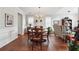 Bright dining room featuring hardwood floors, modern lighting, and elegant wainscoting at 4035 Crabapple Lake Ct, Roswell, GA 30076