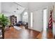 Inviting home entrance featuring hardwood floors, a high ceiling, and natural light at 4035 Crabapple Lake Ct, Roswell, GA 30076